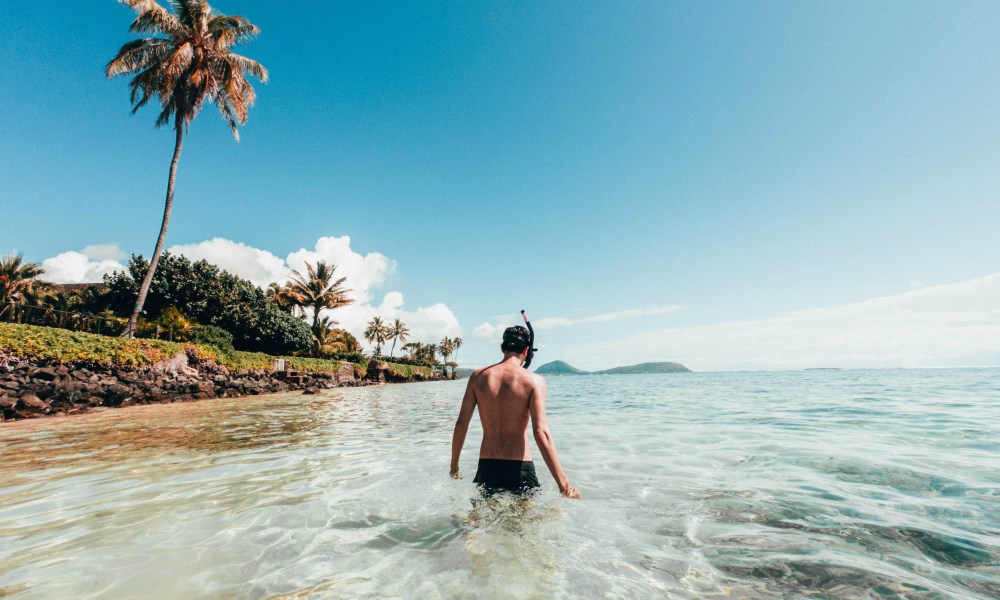 Man wearing swim trunks in the water