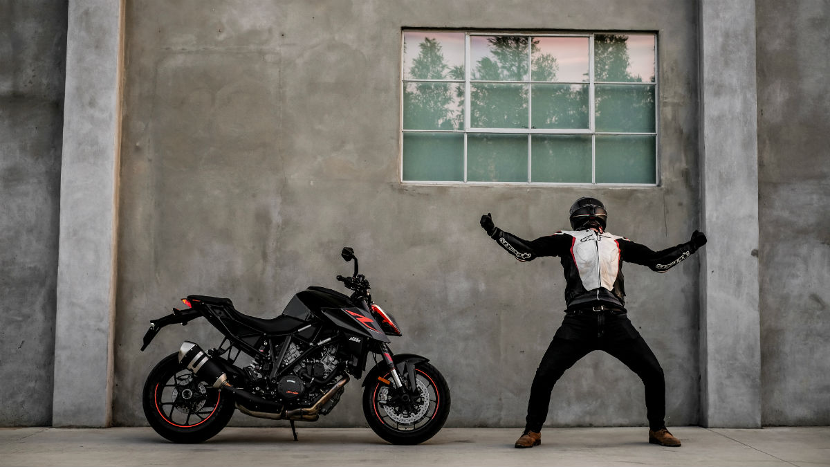 Boy posing with Duke bike - PixaHive