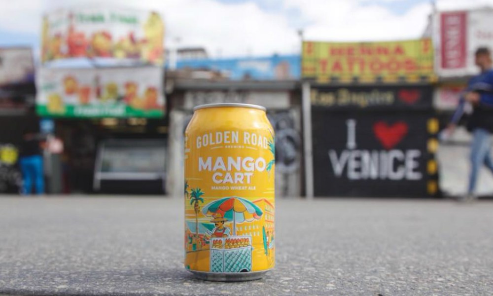 Golden Road Brewing mango cart can on the ground.