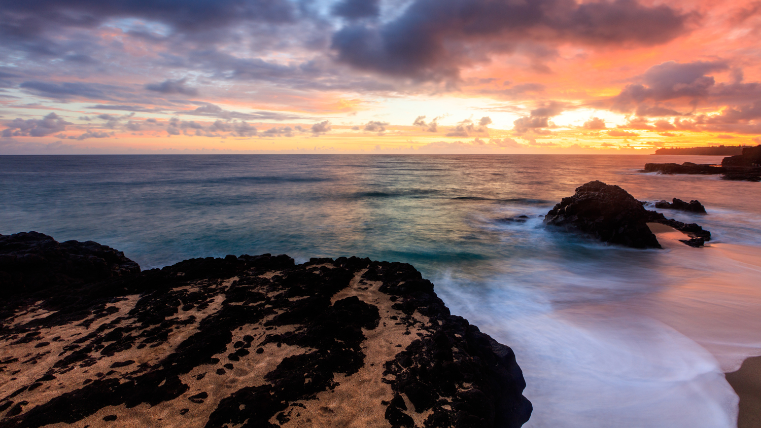 Sunset on Lumahai Beach in Kuaui, Hawaii.