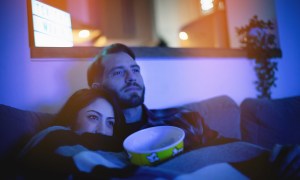 watching movie couple popcorn