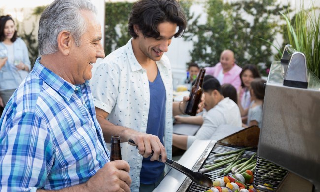 https://www.themanual.com/wp-content/uploads/sites/9/2019/06/father-beer-grilling-barbecue-skewers.jpg?resize=650%2C390&p=1