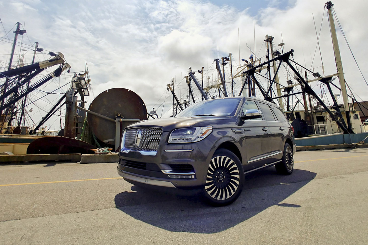 Black Lincoln Navigator Black Label parked in the middle of the road.