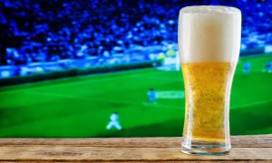 A pint of beer and a soccer match.