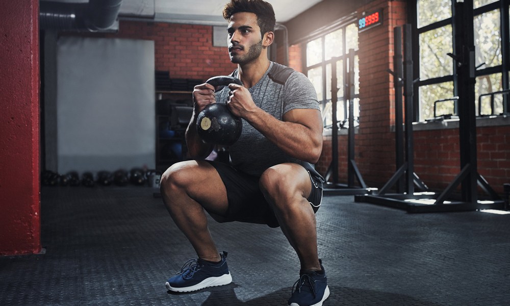 Man doing goblet squats