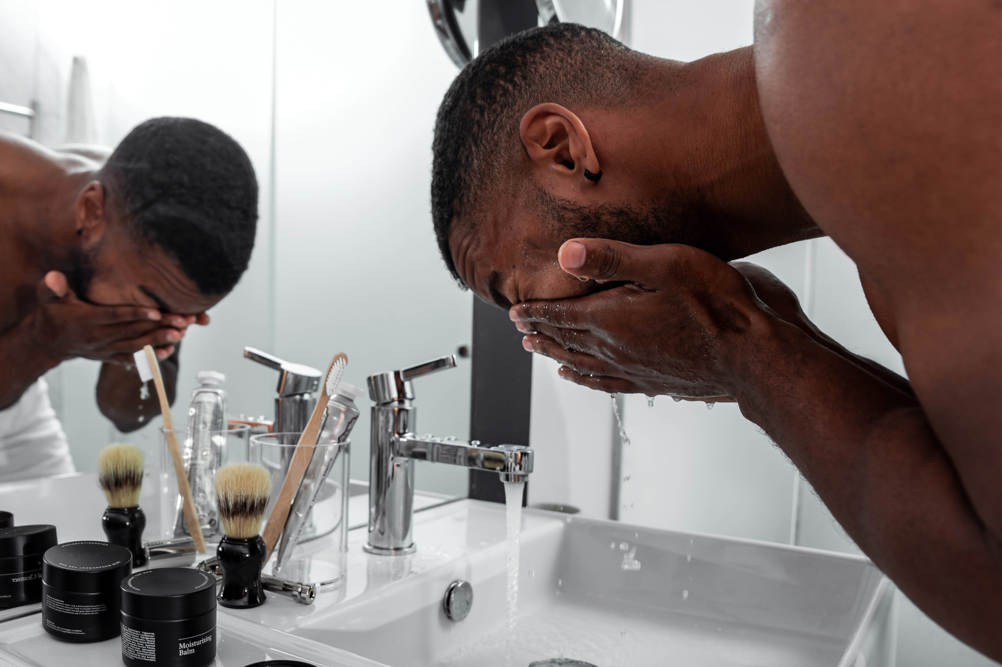 Man washing his face