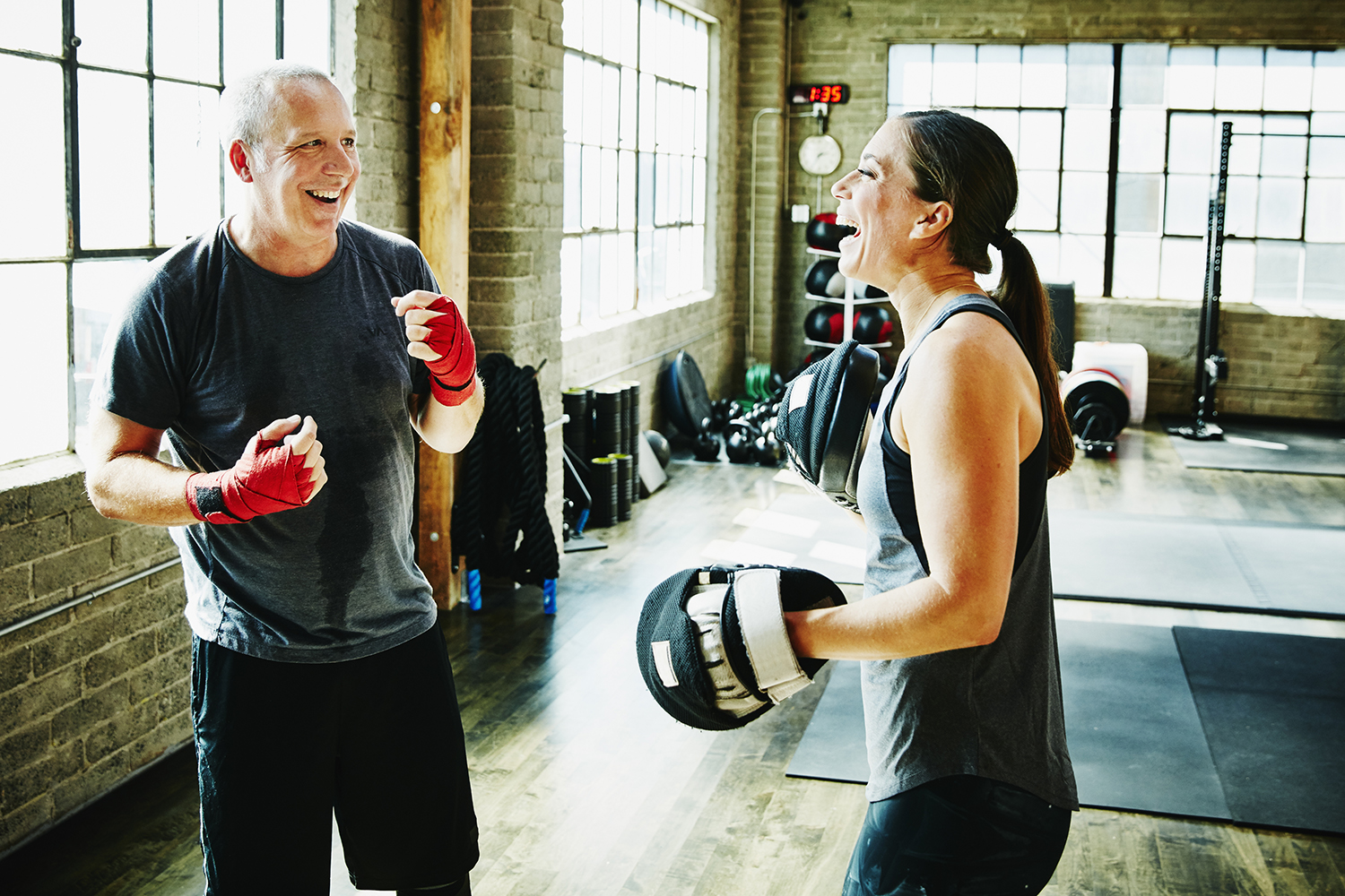 Middle-aged man in a fitness fighting class.