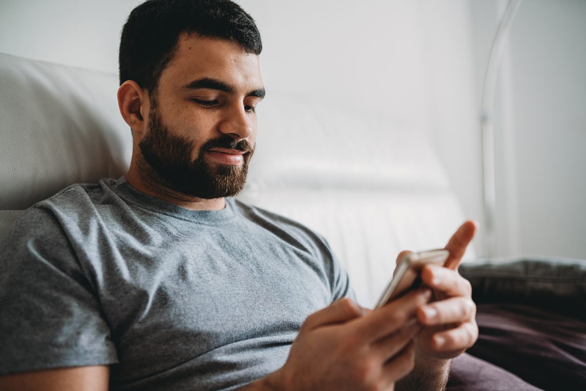 Person on their phone in bed.