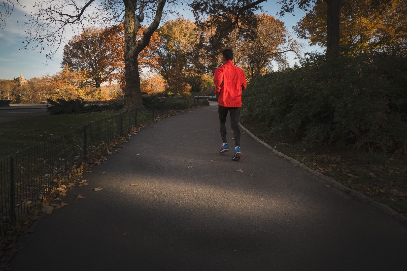 Man running on a paved trail.