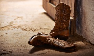 Cowboy boots near a wall