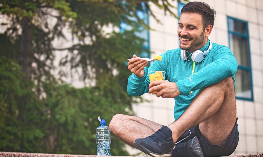 Man eating fruit.