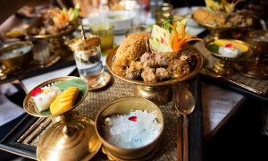 A set of Traditional Thai food Khao Chae on brass bowls and platters