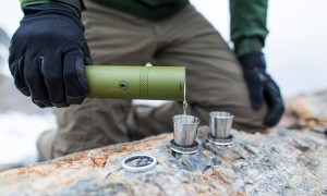 Man pouring liquor from a flask