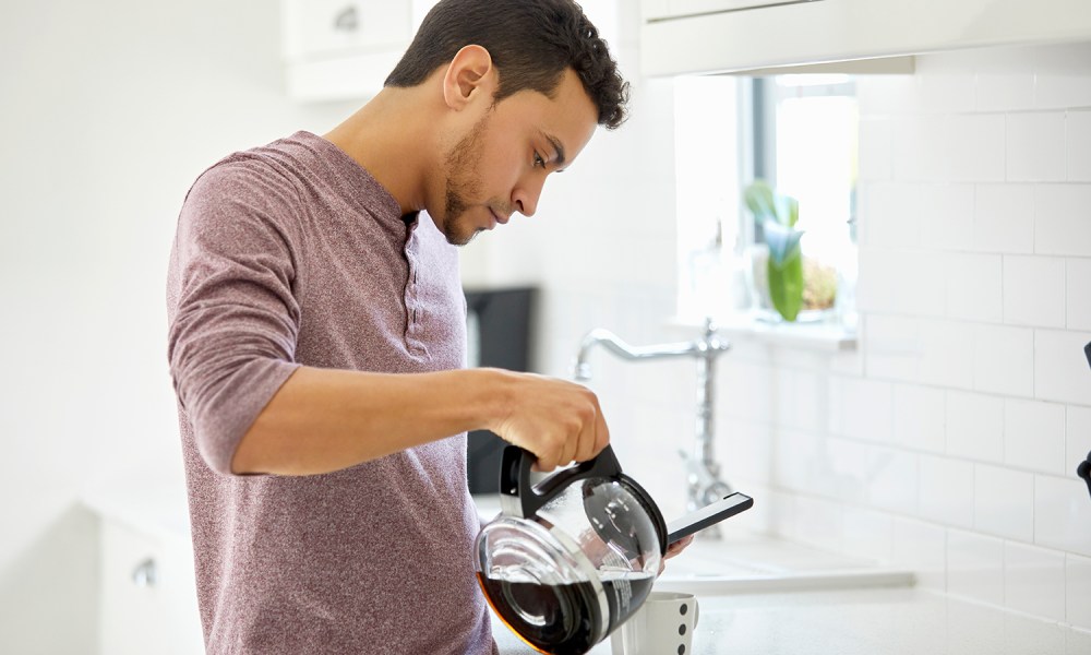 Man pouring a cup of coffee