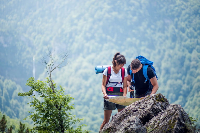 Backpackers reading a map