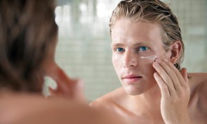 how wear camera friendly makeup man applying facial cream