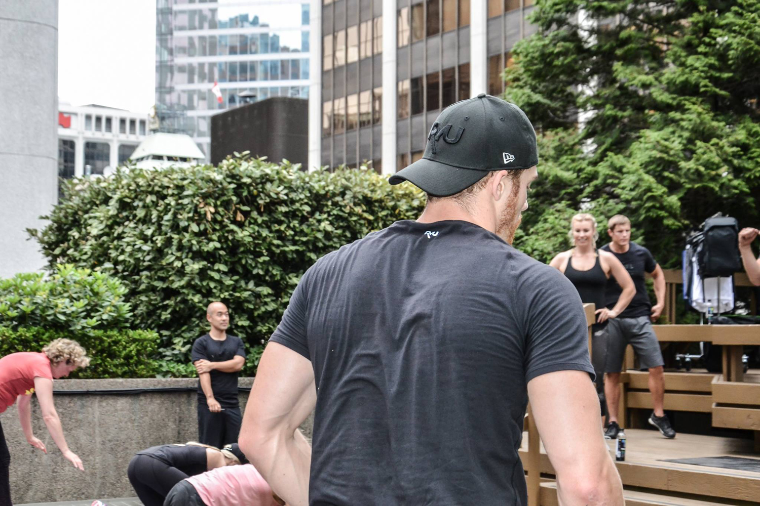 A man working out with other people.