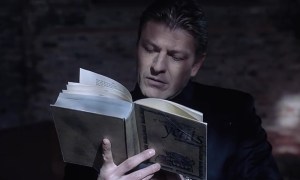 Sean Bean with a book