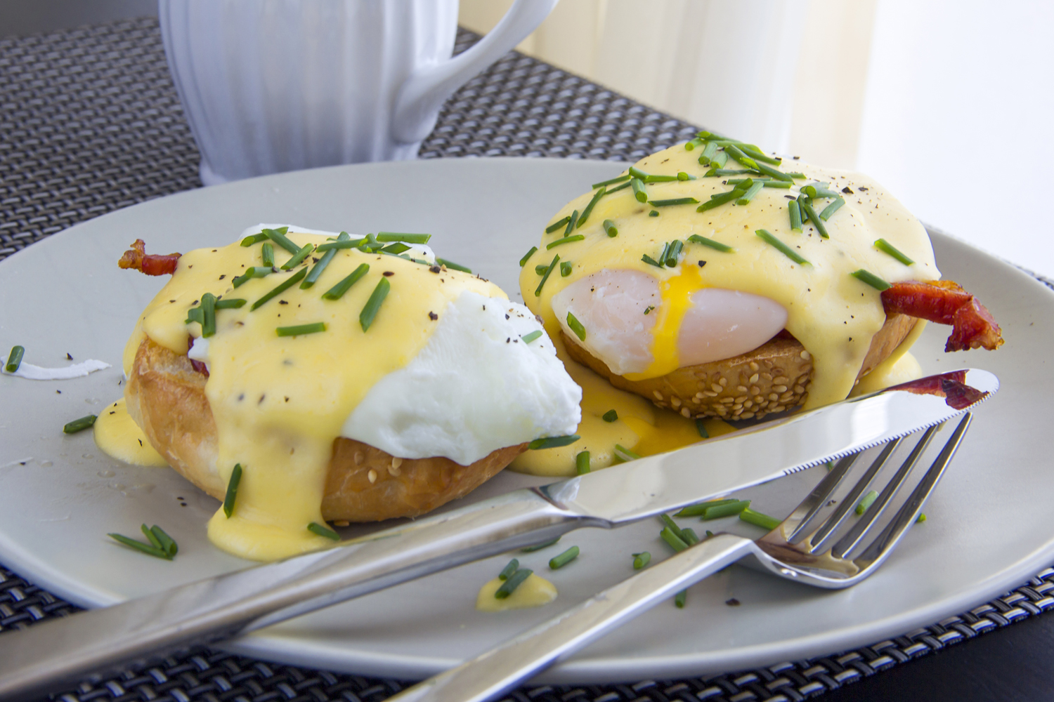 Eggs Benedict. toasted muffins, ham, poached eggs, and delicious buttery hollandaise sauce