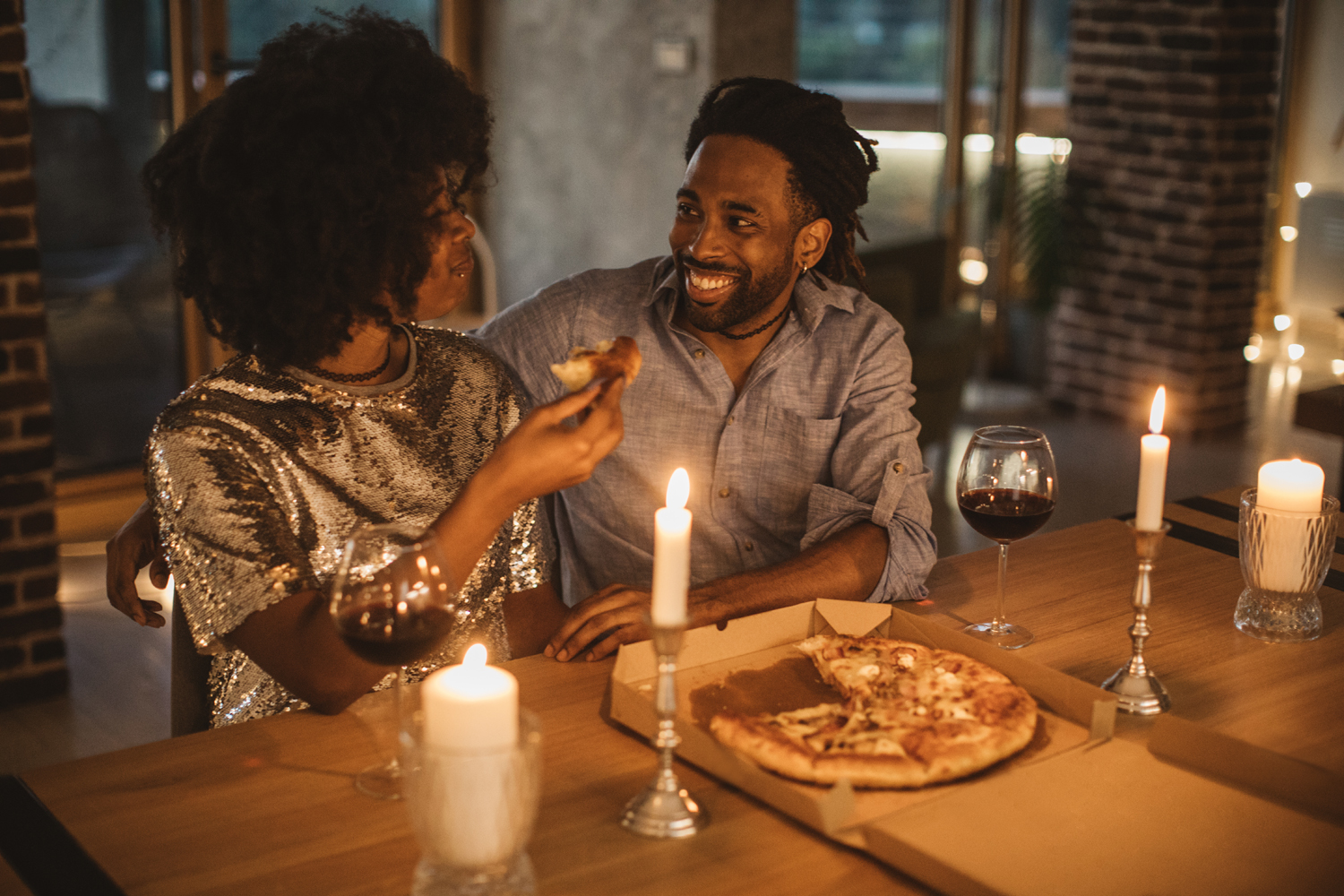 Couple enjoying a romantic pizza date night