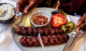 Turkish Adana kebab plate with grilled vegetables