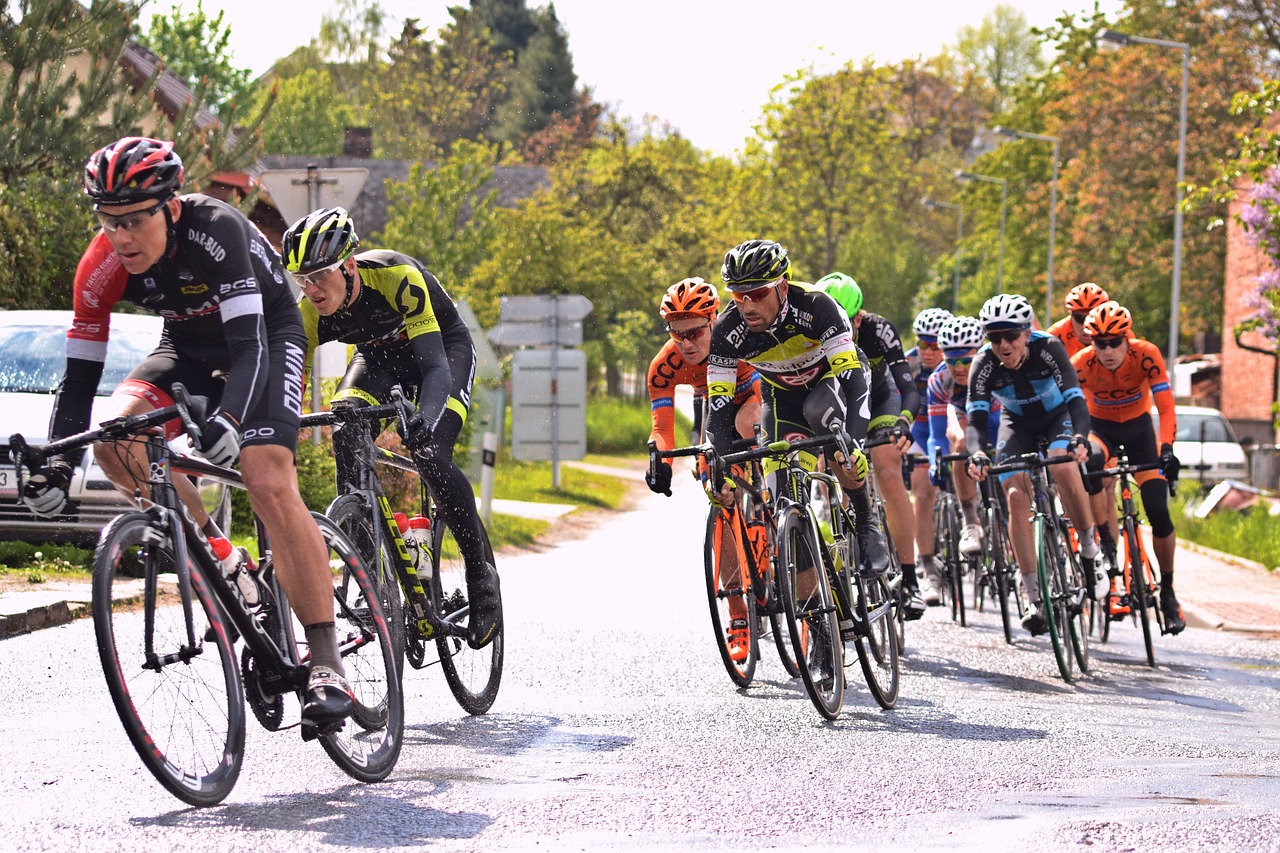 Group of men cycling on a road