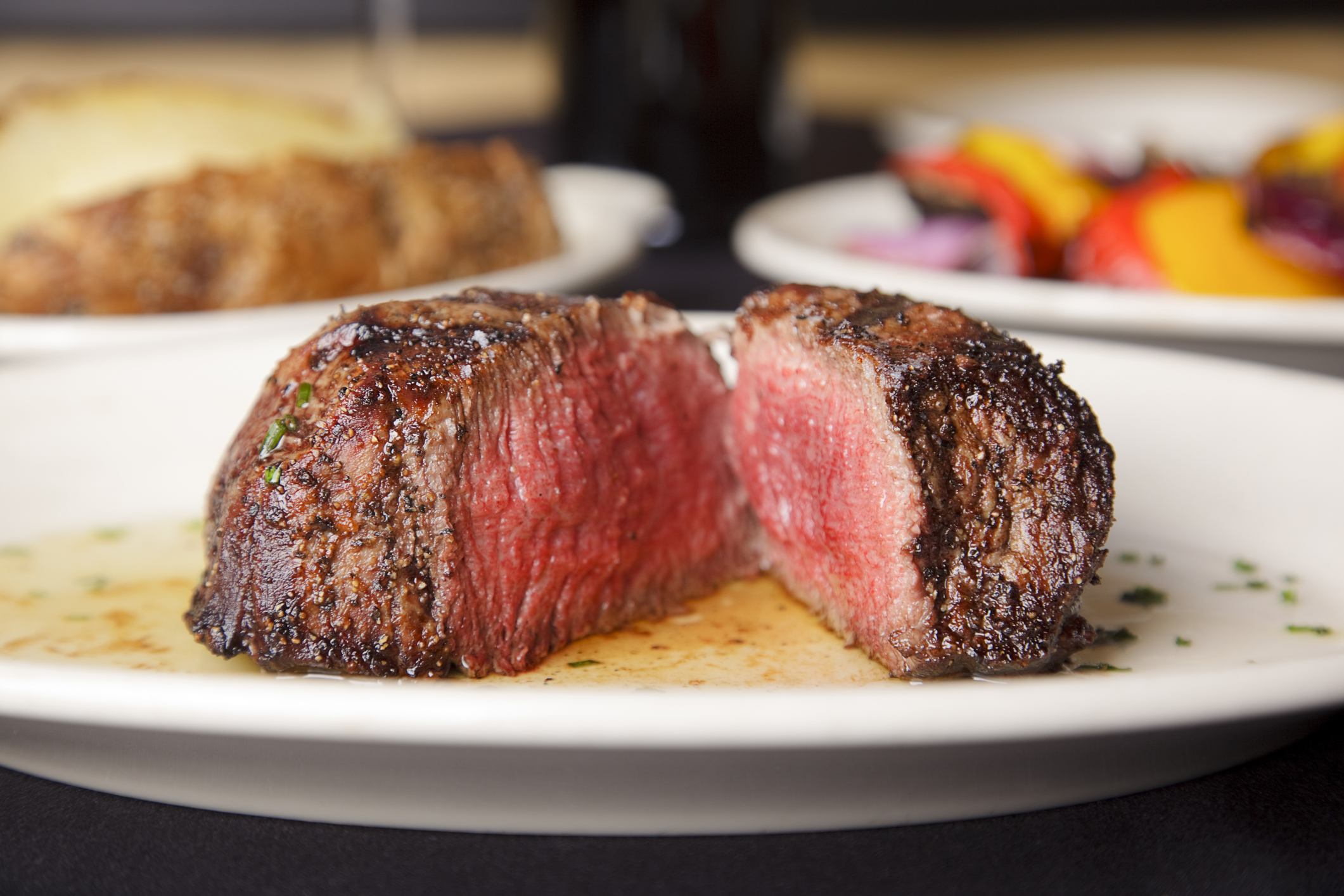 Perfectly cooked filet mignon cut in half.