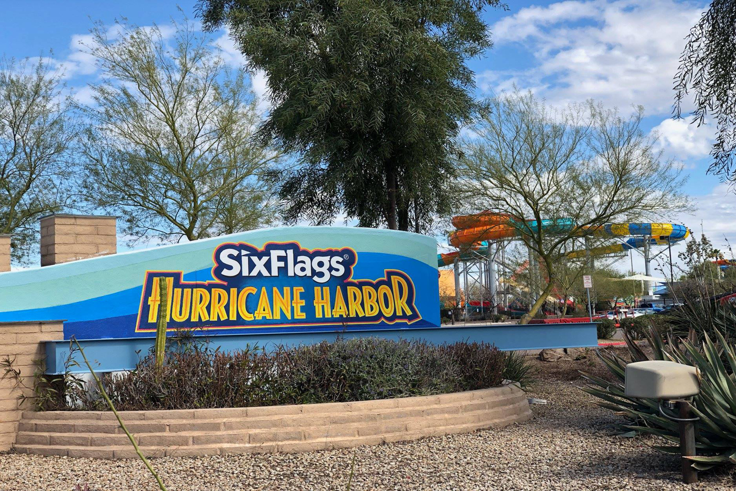 A wall signage that says Six Flags Hurricane Harbor.