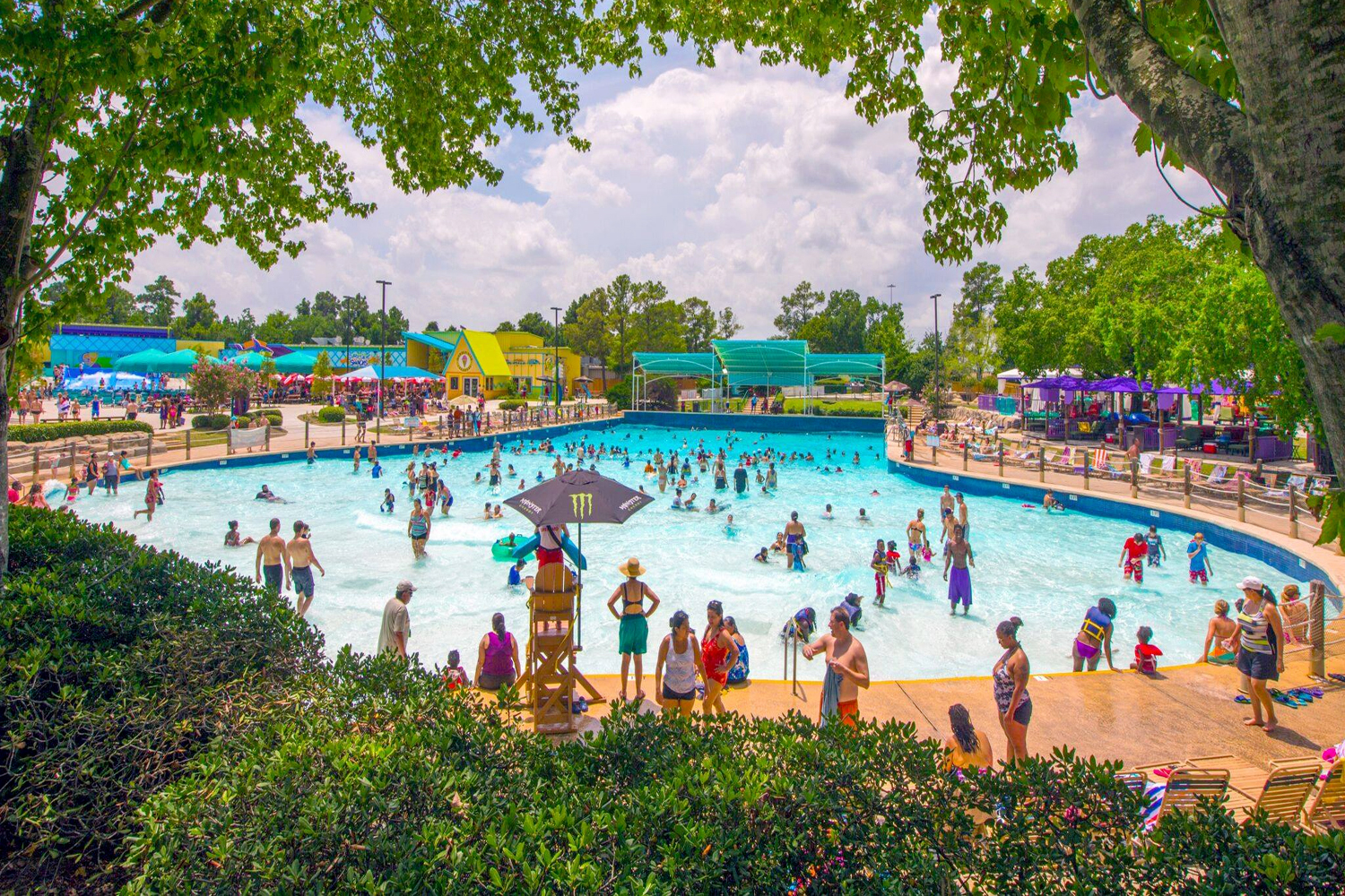 Guests at a pool in Hurricane Harbor Splashtown.