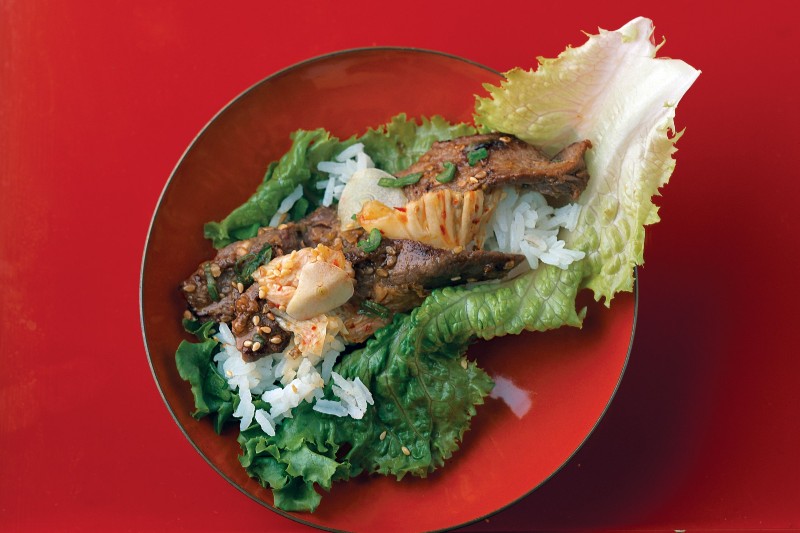 Bulgogi marinated beef on bed of lettuce and rice.