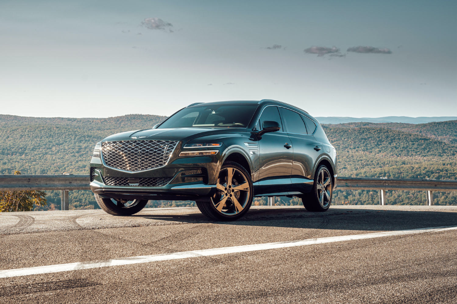 2021 Genesis GV80 on the side of a road in front of hills.