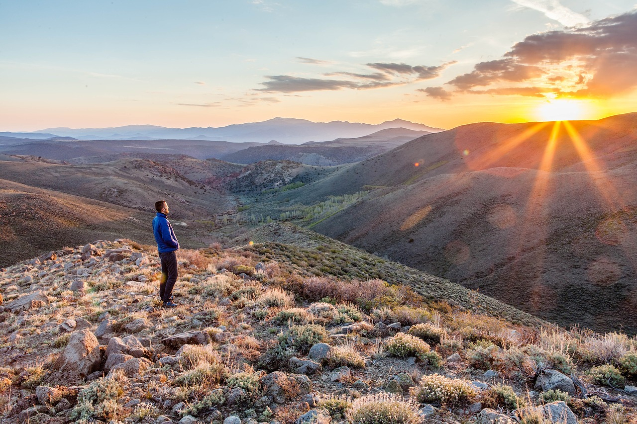 microadventure ideas for summer man hiking alone at sunset featured image