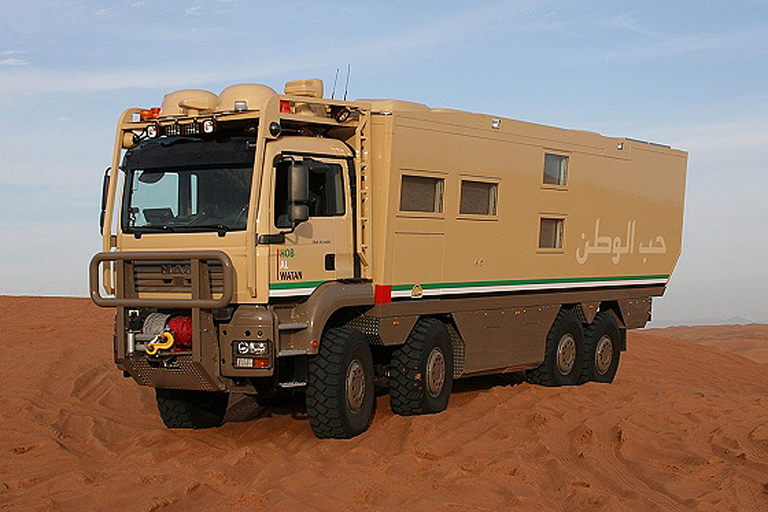 A Unicat Terracross overlanding vehicle parked in the desert.