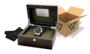 A silver watch in a wooden box