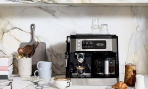 De'Longhi All in One Combination Coffee Maker lifestyle on kitchen counter with drinks.