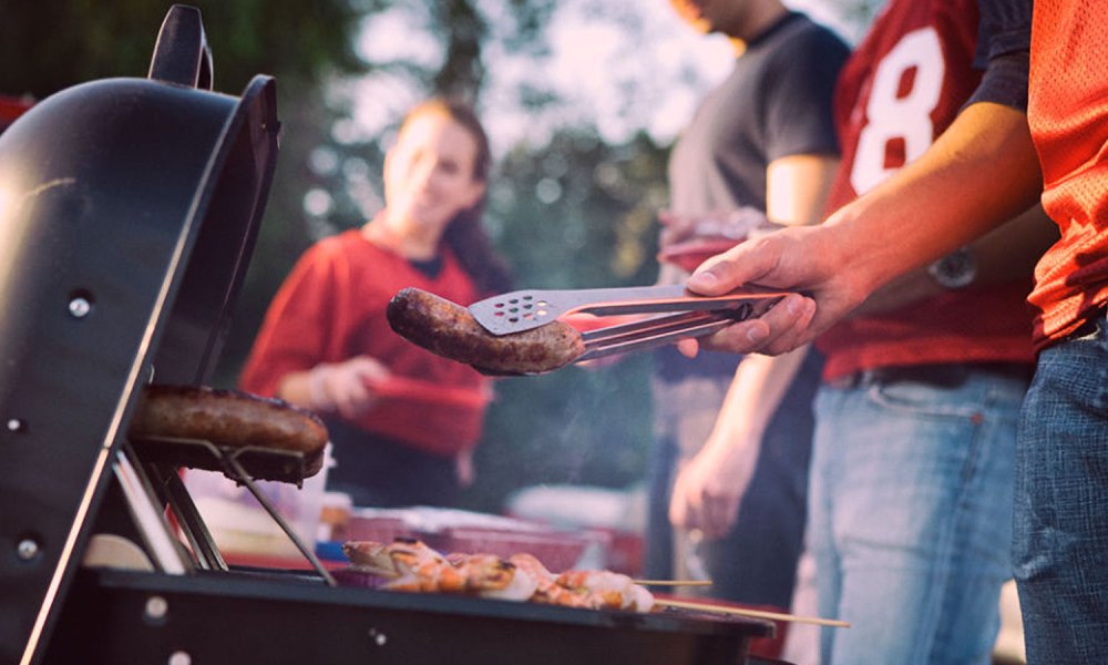 Grilling at a tailgating party.