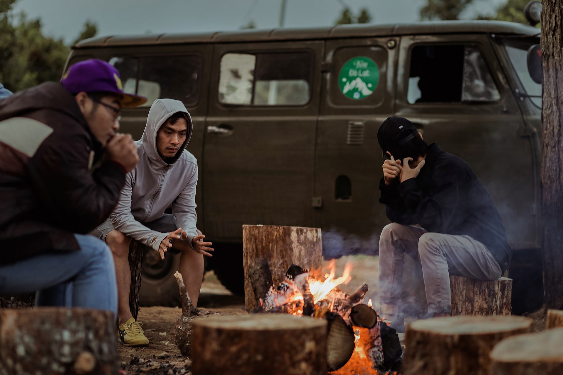 camping in the fall around campfire.