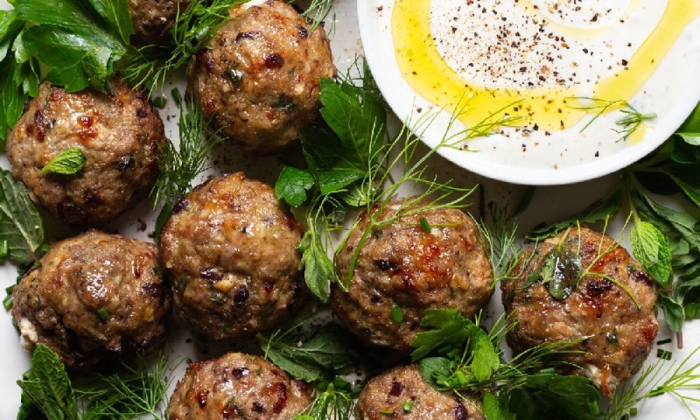 Feta lamb meatballs with creamy sauce.