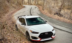 Hyundai Veloster N front end pasenger side from above in forest.