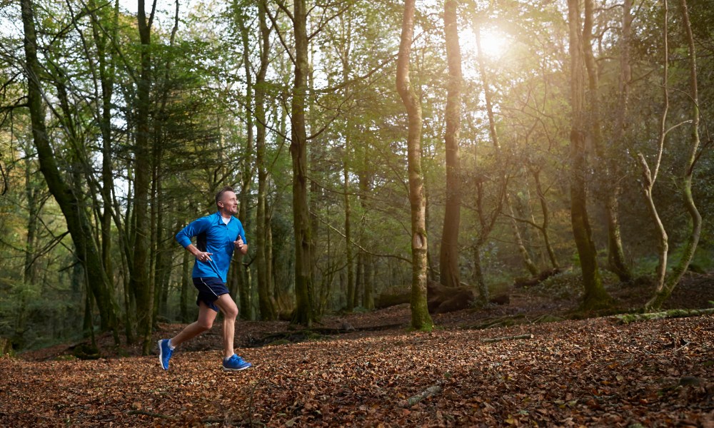 Man running in the woods.