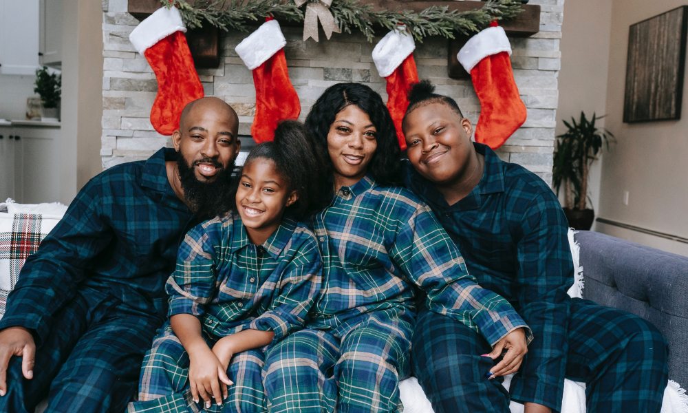 Family wearing matching family pajamas.