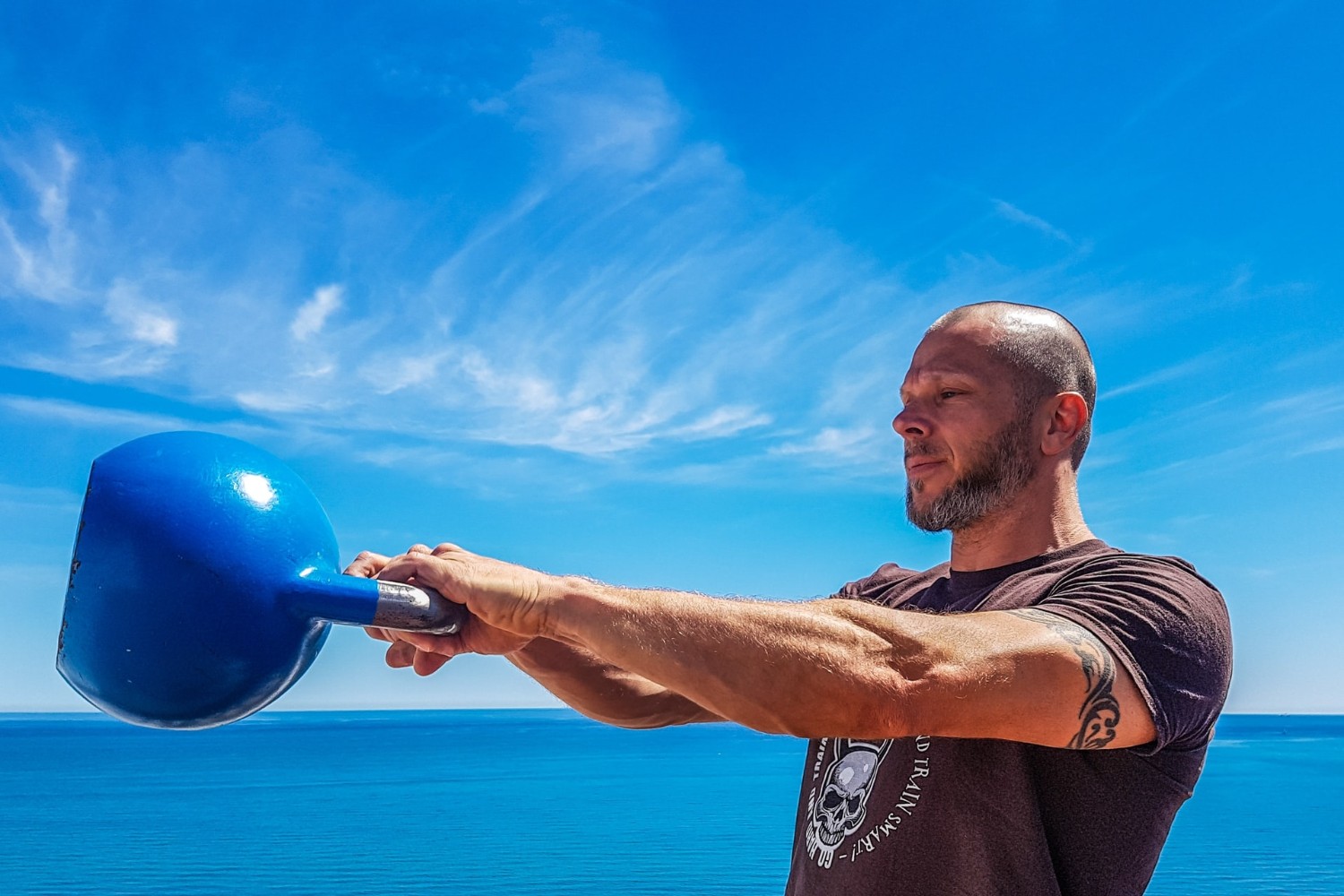 Man doing kettlebell swings