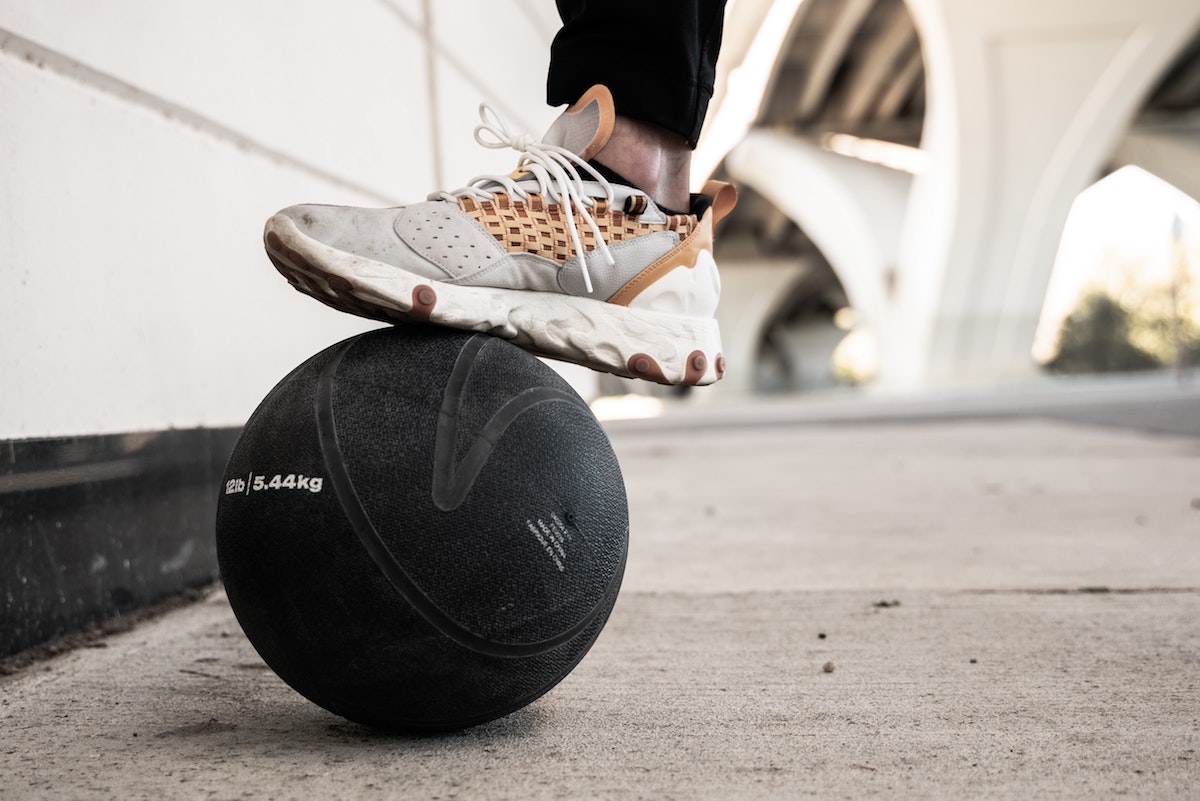 Sneaker on top of a medicine ball