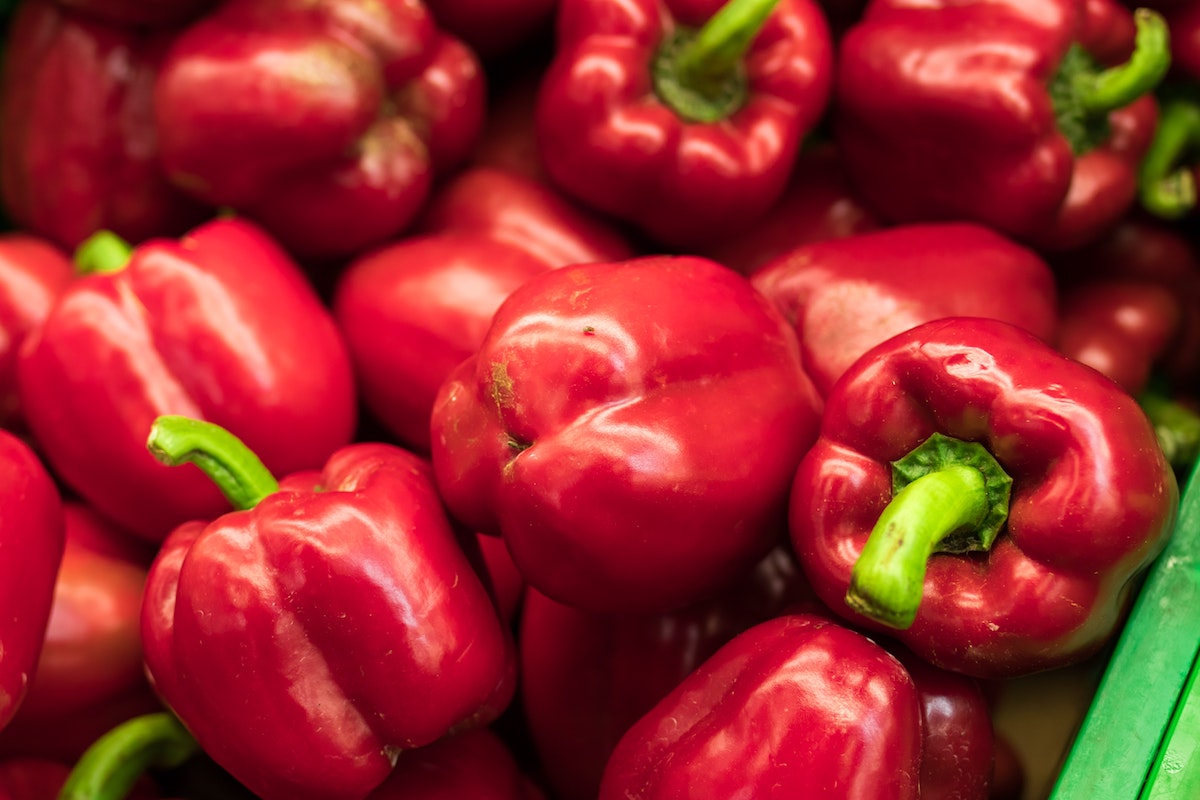 basket full of Red bell peppers.