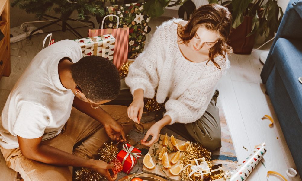 woman giving man a gift.