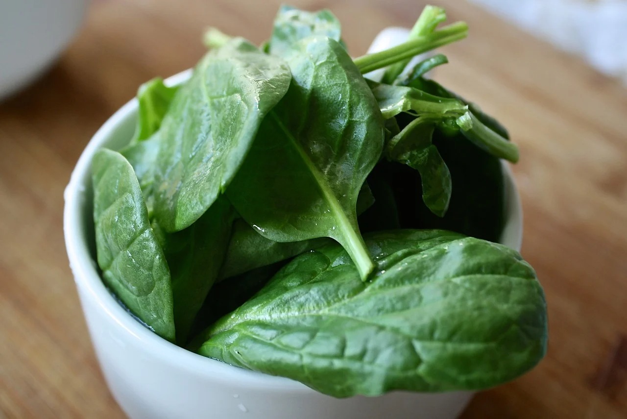 Spinach leaves in a bowl.