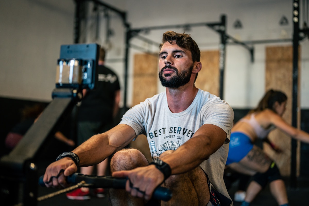 Man using a rowing machine.