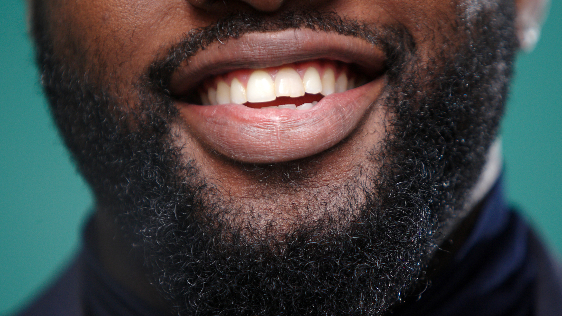 man smiling with teeth