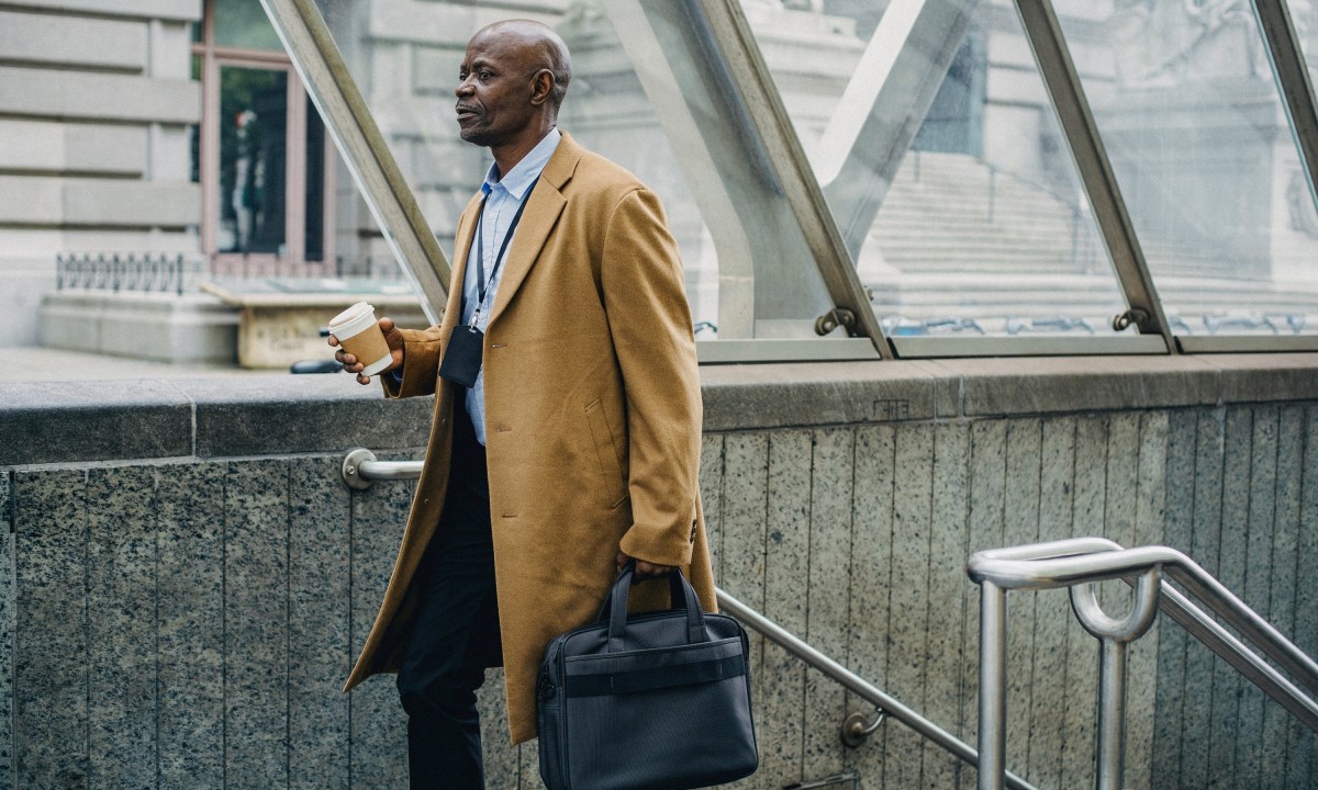 Man in trench coat with briefcase