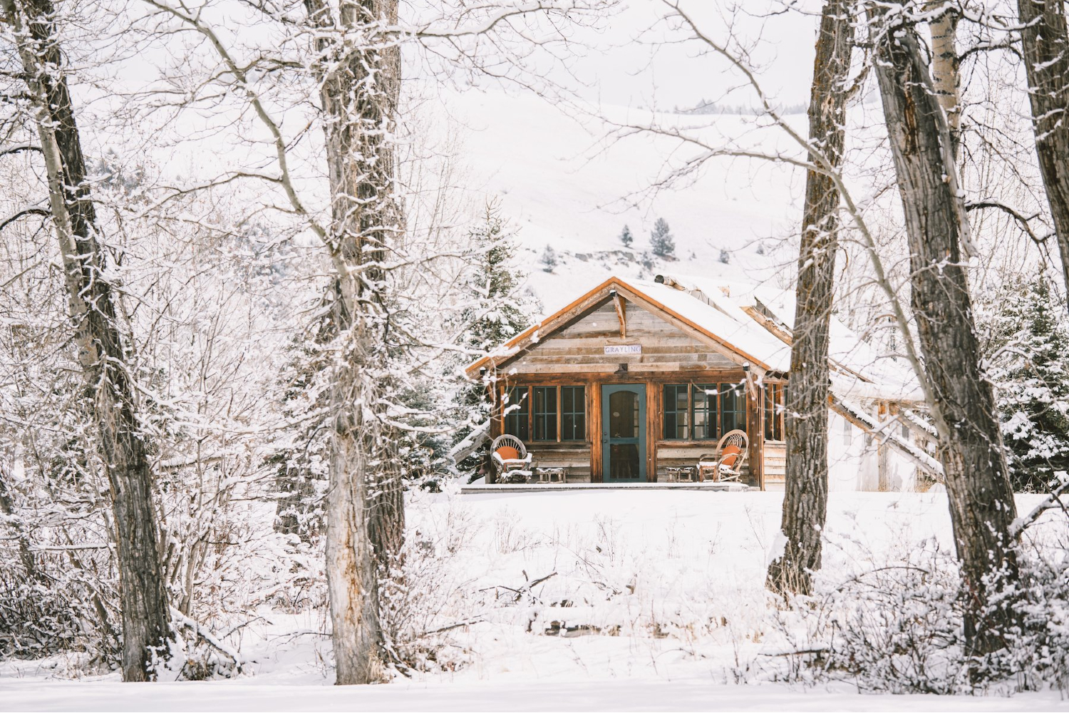 A snowy winter cabin at the Ranch at Rock Creek.